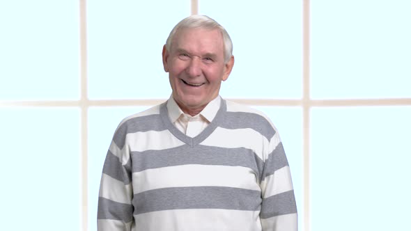 Happy Laughing Senior, Blurred Background. alt