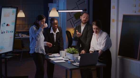 Excited Multi Ethnic Businesspeople Receiving Good News Clapping While Standing at Table Conference alt