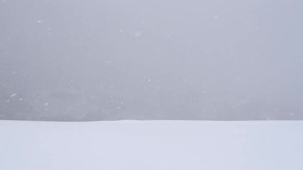 Fantastic Snowstorm in Winter Mountains