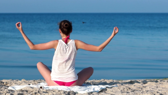Yoga On The Beach, Calm, Tranquility, Relaxation, Sexy Girl Meditating At Sunrise On The Ocean. alt