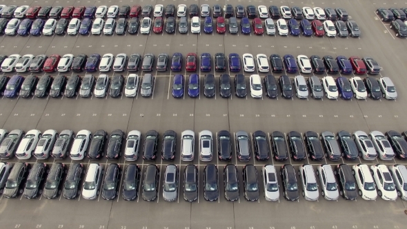 Flying Above Storage Parking Lot Of New Unsold Cars, Aerial View alt