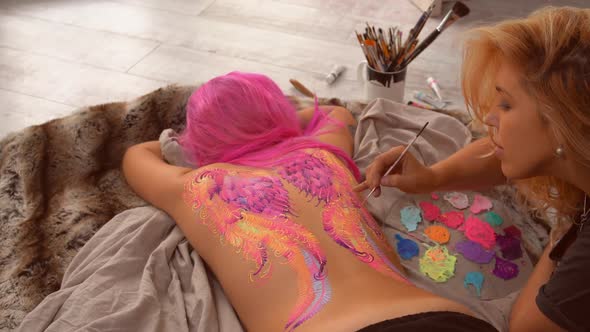 Painting of Pink Circles on a Female Body alt
