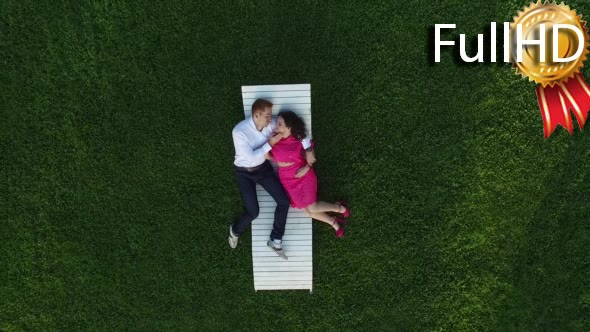 Aerial Video of Couple Lying on the Lawn 
