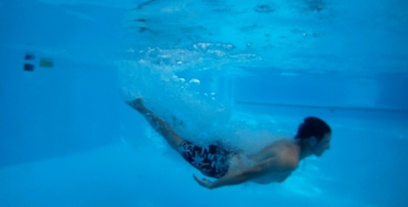 Man Jumping Into the Pool