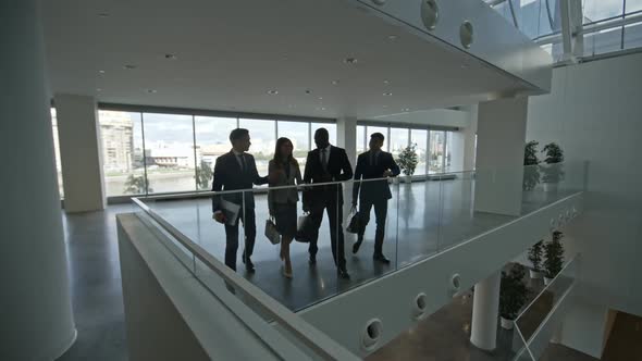 Business Partners Talking in Modern Office Building alt