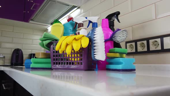 Different Products and Items for Cleaning on the Floor in the Kitchen