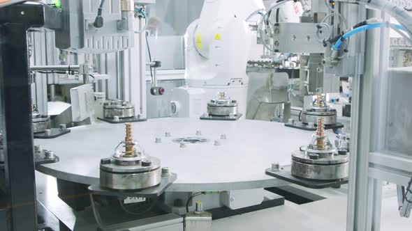 Advanced robotic machine manufacturing parts in an automated assembly line alt