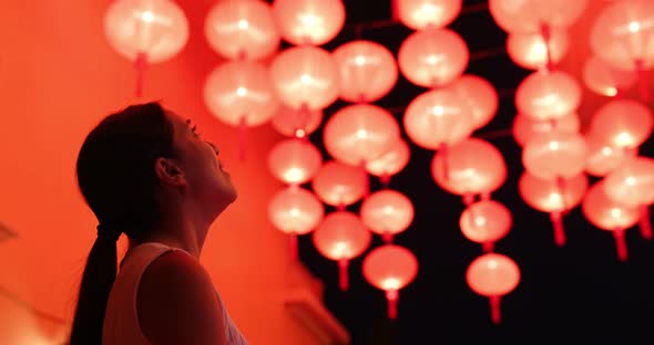 Woman Look at The Red Lantern at Night alt