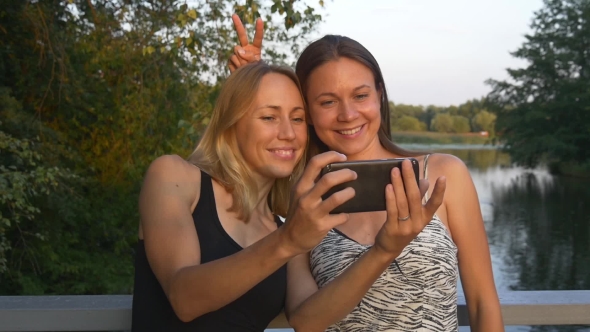 Girlfriends Taking Selfie In The Park