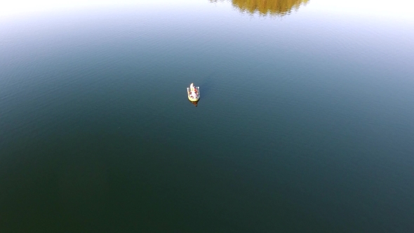 People Travel In Tourist Boat Over Lake