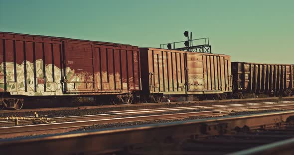 Freight Train Cargo Cars Departing Station at Empty Industrial City Railway Yard. Locomotive wagons alt