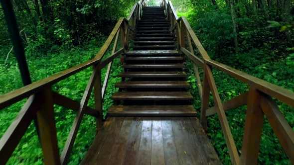 Walk Up Via Wooden Stairs With Railing