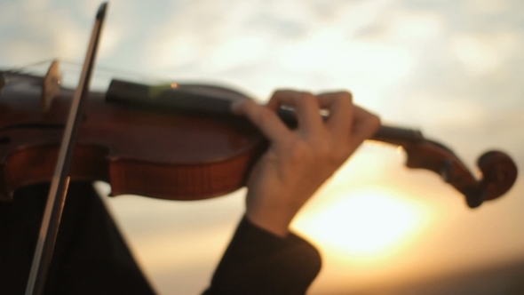 Violin. Violinist Playing At Sunset. Strings And Bow.