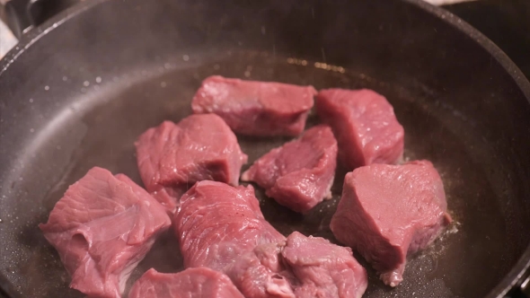 Frying Meat on Hot Pan