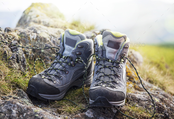 Mountain boots on the cliff