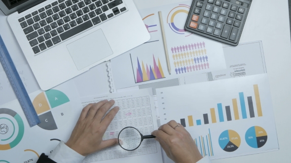 The Above View Of a Financial Specialist, Businessman Working With Blueprint, Graph. alt