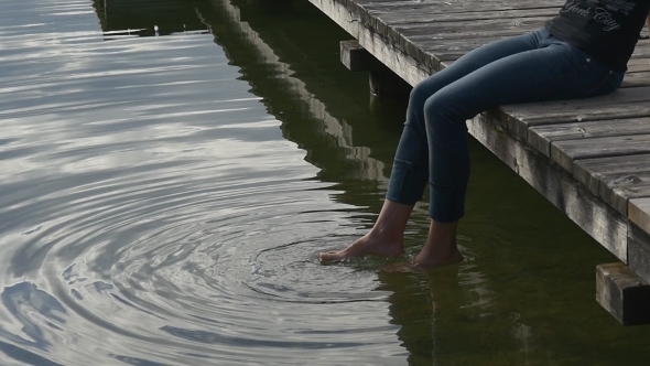 Woman Feet Splash Water Into Big Wave