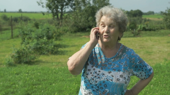 Old Woman 80s Telling On The Smartphone Outdoors alt