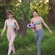 Two Young Fit Women with Sports Mats Go for Yoga Pilates or Fitness Training Outdoors - VideoHive Item for Sale