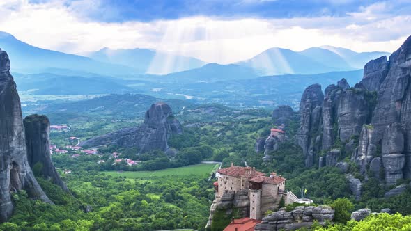 Beautiful timelapse view of Meteora valley, rocks and Rousanou nunnery in Greece, zoom out, tilt