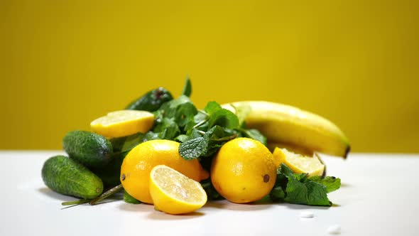 Closeup Healthful Organic Vitamin Fruits and Vegetables on Table with White Pills Falling in Slow alt