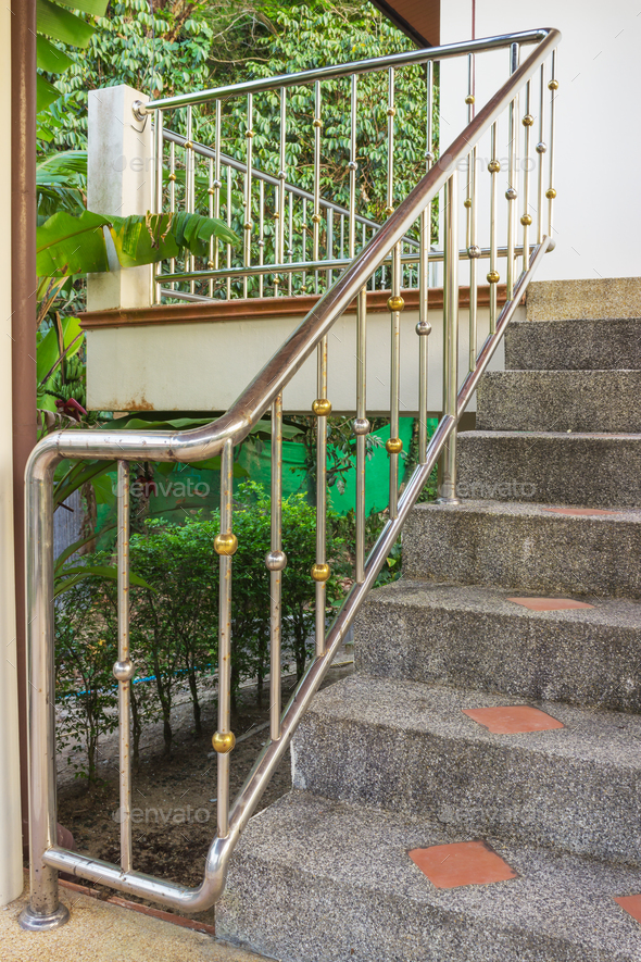 Steel railing on a stone staircase