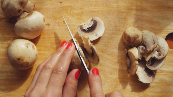 Cooking Cutting Mushrooms In The Kitchen