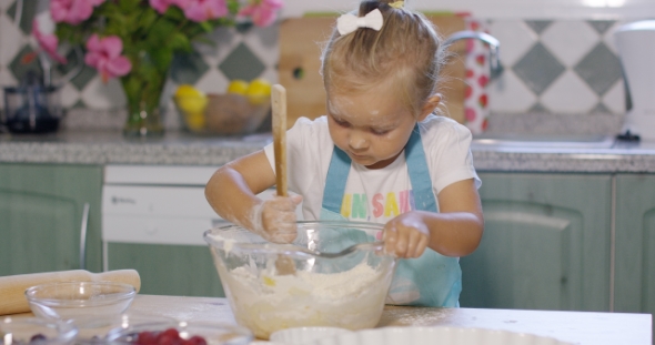 Pretty Little Girl Baking a Homemade Tart alt