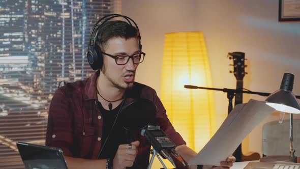 News Anchor Training His Public Speaking Skills to Deliver the News to the Audience alt