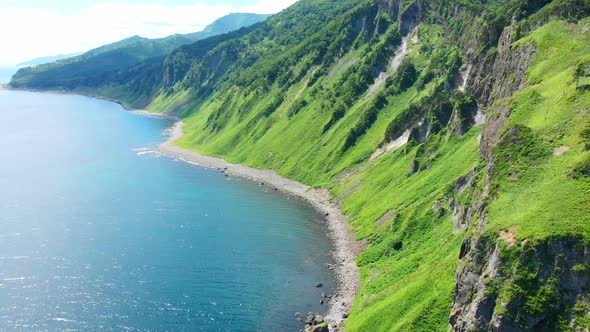 Shiretoko peninsula coastal view with fishing boats alt