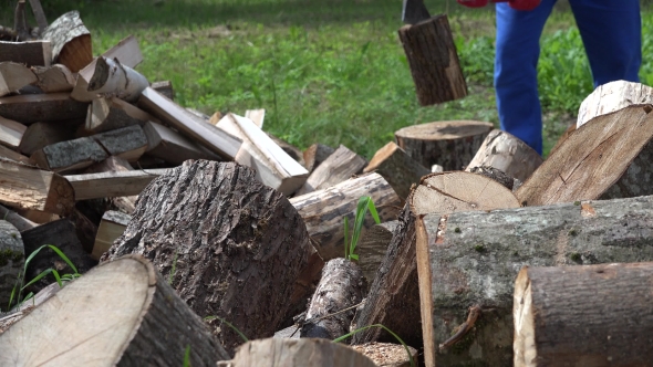 Blurred Farmer Man Chop Wood With Axe.