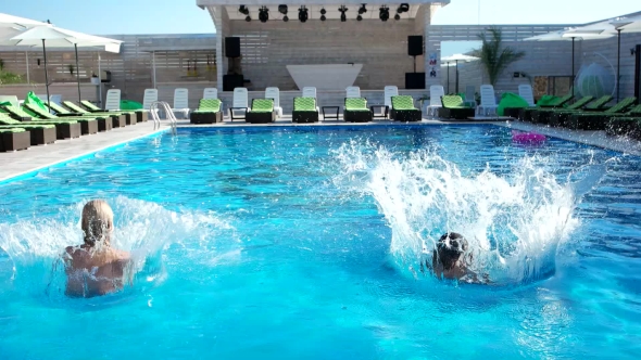 Sexy Girls Dive Into The Pool, Happy Summer. alt