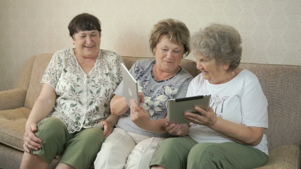 Old Women Holding The Digital Tablets
