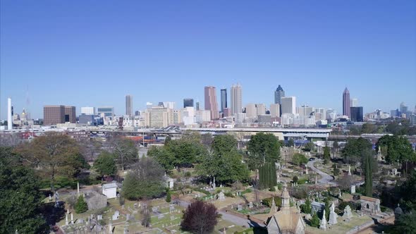 Pedestal Down Shot From Atlanta Skyline to Oakland Cemetery alt