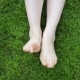 Movement And Rubbing Female Legs Against Each Other On a Background Of Green Grass - VideoHive Item for Sale