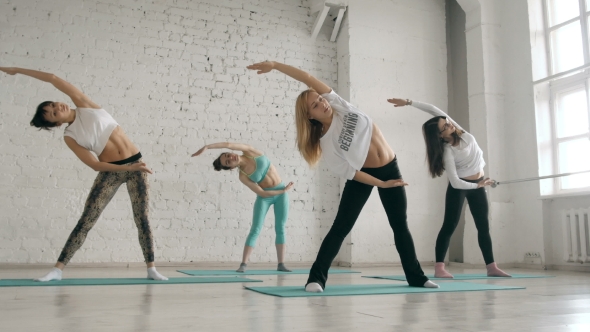 Young Girls Doing Yoga, Group Of People In a Stretching Class, Healthy Lifestyle alt