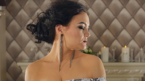 Portrait Of a Brunette Woman With Big Lips Turns Her Head. The Wind's Blowing alt