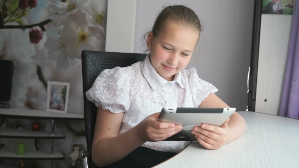 Teenager Girl Holding a Digital Tablet Computer