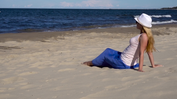 Young Woman Relaxing On The Beach