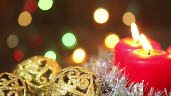 Burning Candles And Christmas Decorations
