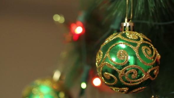 Green Ball With Sparkles on a Christmas Tree alt