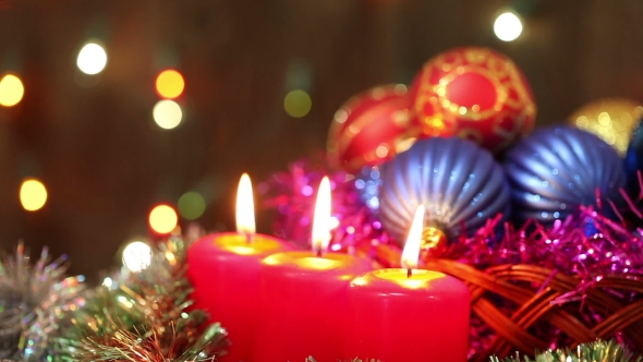 Burning Candles And Christmas Decorations.