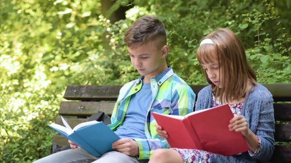 Boy And Girl Reading Book