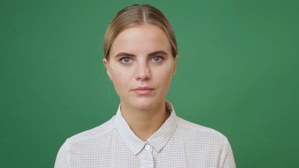 Woman In White Shirt Looking Straight alt