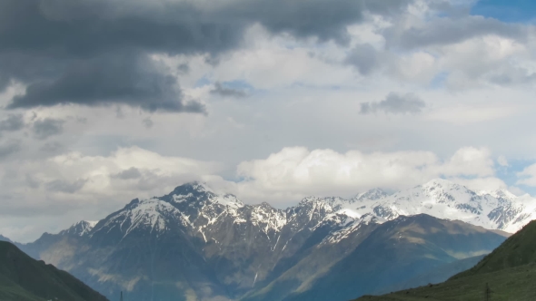 Clouds Moving Over The Georgian Mountains. Mount Kazbek.  alt