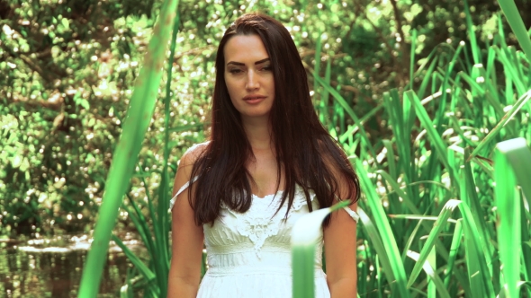 Beautiful Brunette  Near The Pond.