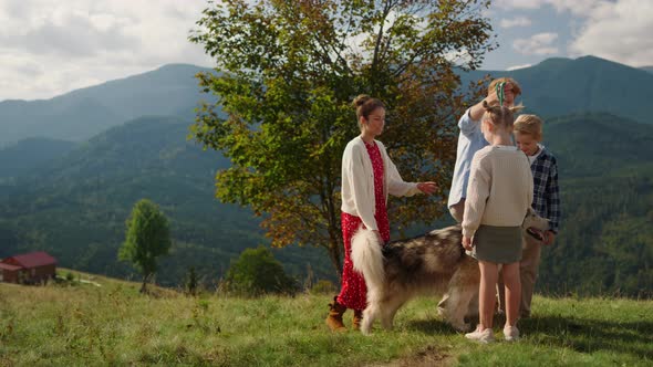 Happy Family Husky Going on Mountain Hill Summer Day alt