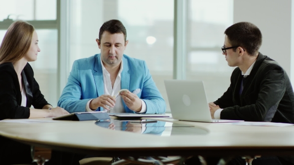 Smiling Boss Giving Money