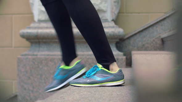 Woman Legs In Sport Shoes Walking Down Stairs. Legs In Running Shoes ...