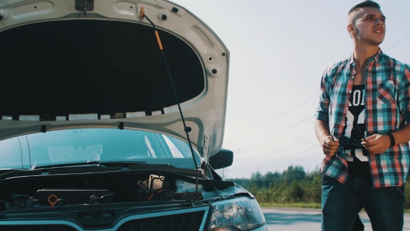 Boy Look In Broken Car At Road. Talk On Phone. Waiting For Help. Summer. Trouble alt